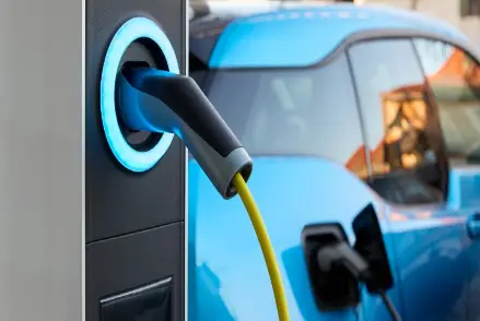 Electric car being charged by EV charging station
